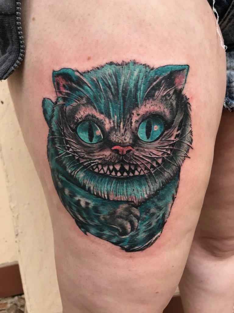 Student work: colourful grinning cat tattoo