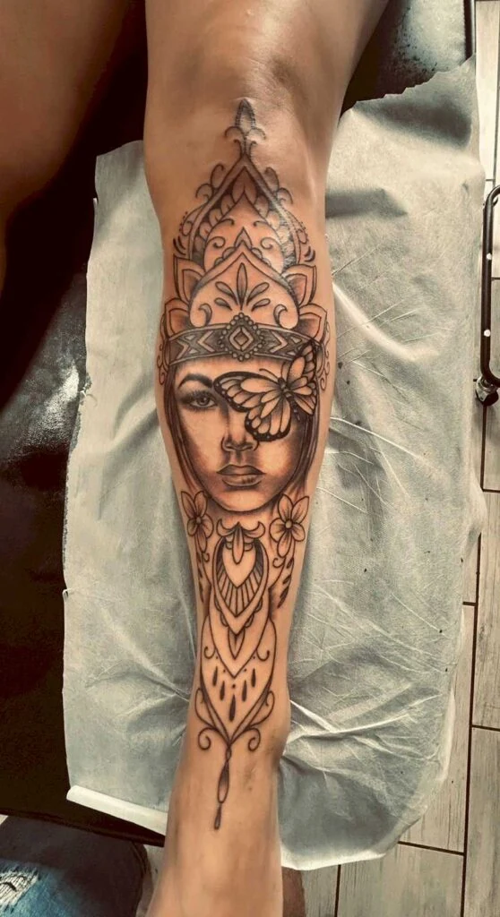 Student work: ornamental portrait tattoo on a forearm